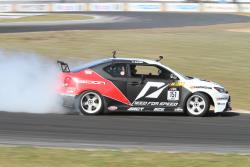 Fredric Aasbo drifts the Papadakis Racing Scion tC2 at Road Atlanta in 2011